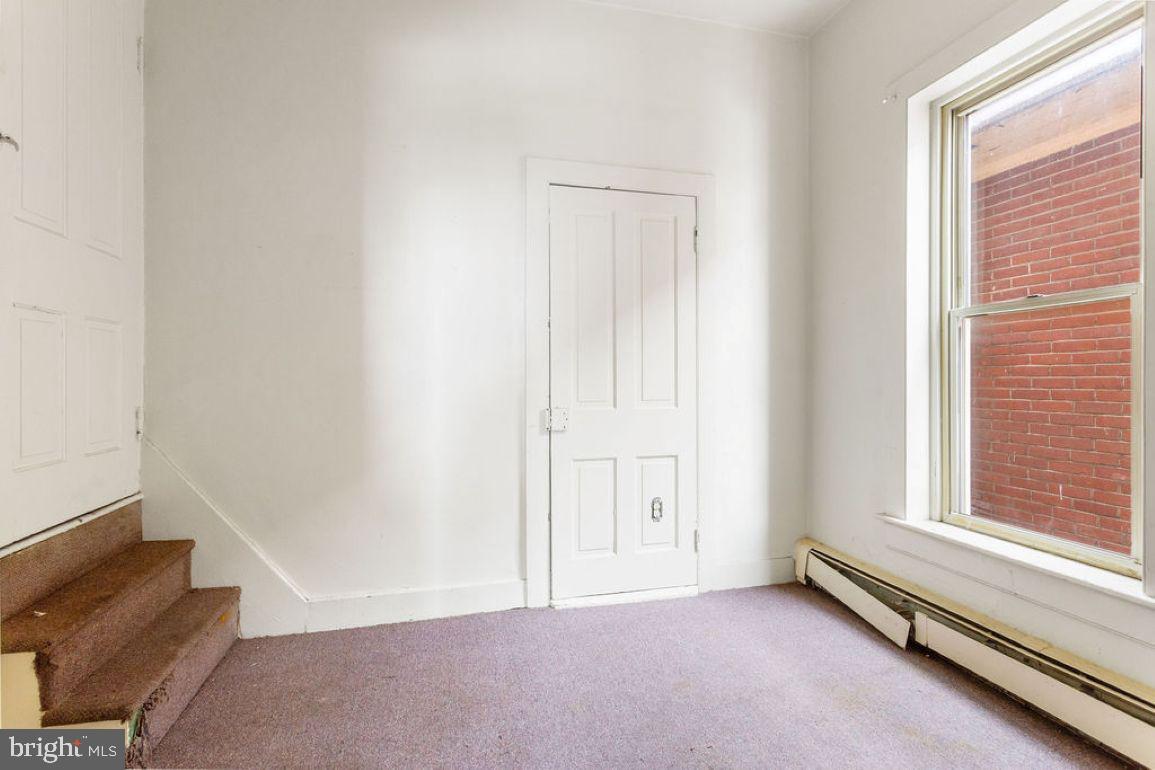 138 Pleasant Street Hanover, PA 17331 - Photo 10 of 39 an empty room with windows