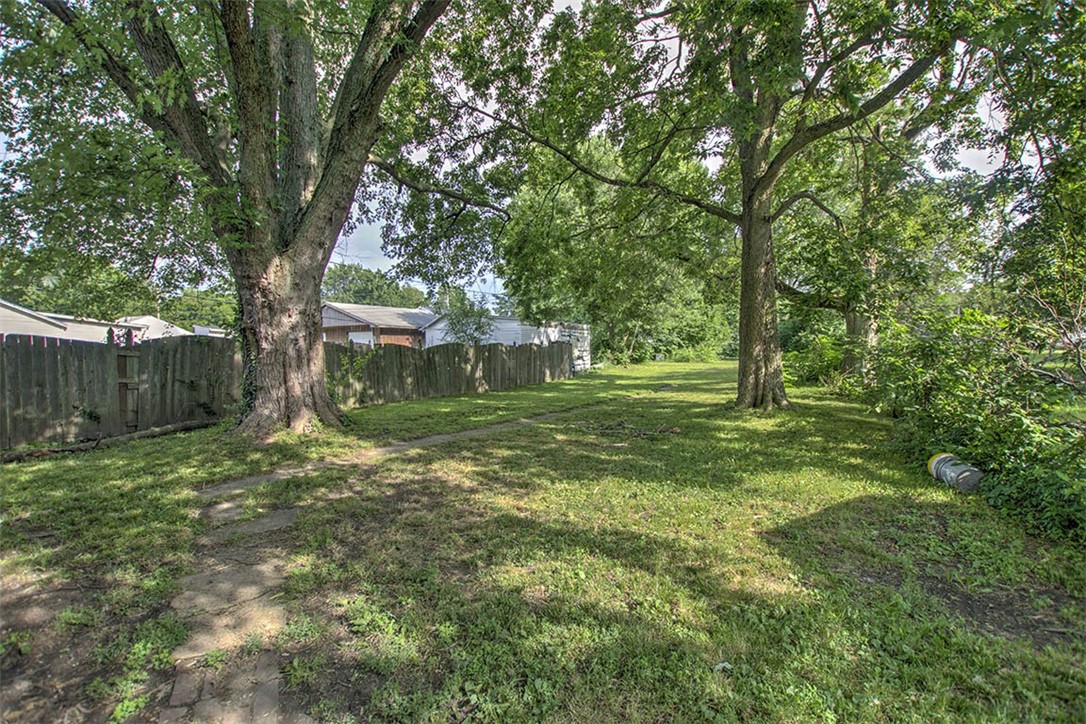 1645 East Wood Street Decatur, IL 62521 - Photo 7 of 8 a backyard of a house with lots of green space