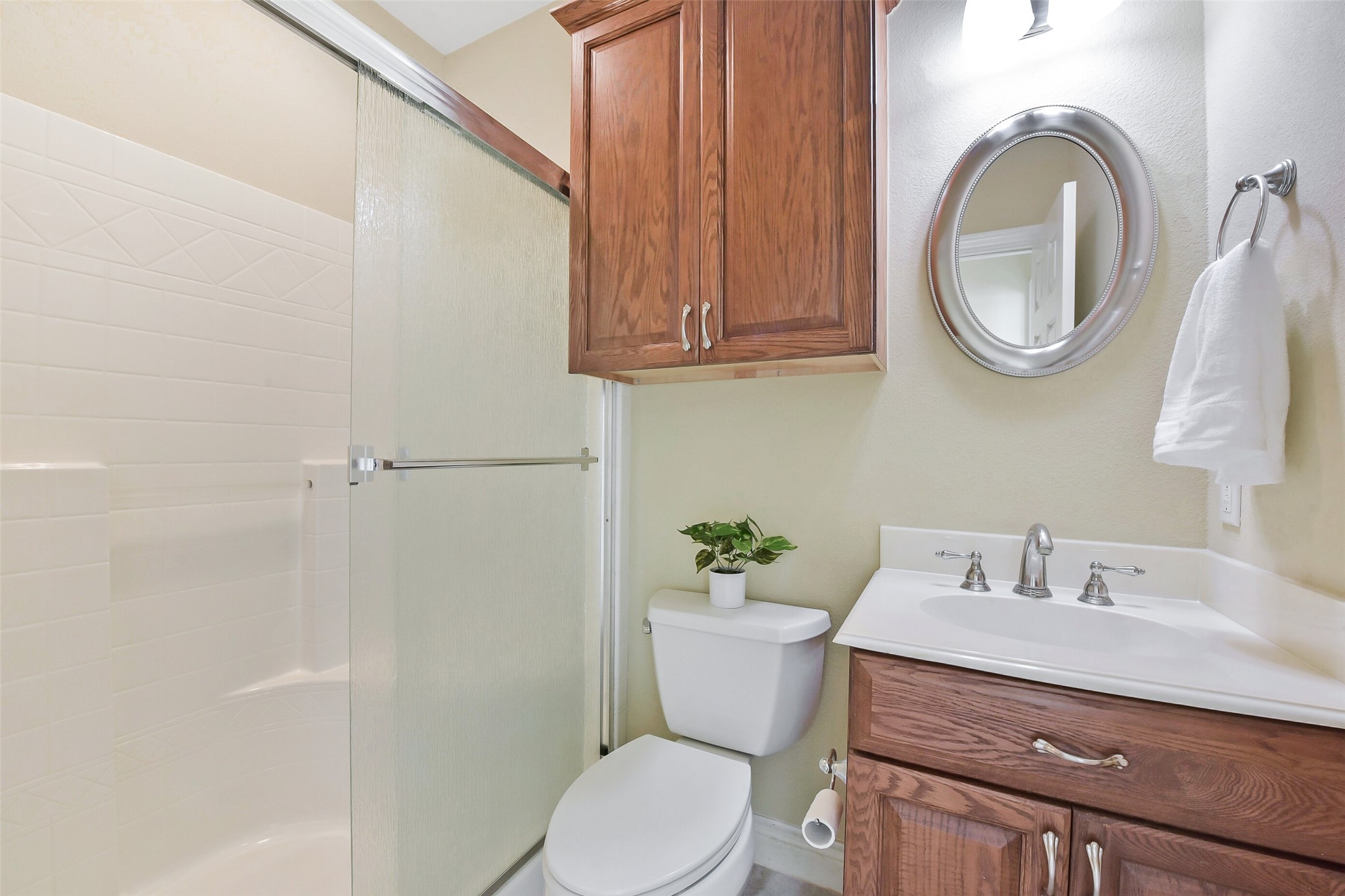 1 Loggerhead Hitchcock, TX 77563 - Photo 35 of 50 a bathroom with a sink a toilet and a mirror