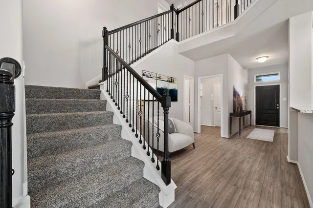 a workspace with furniture and a flat screen tv