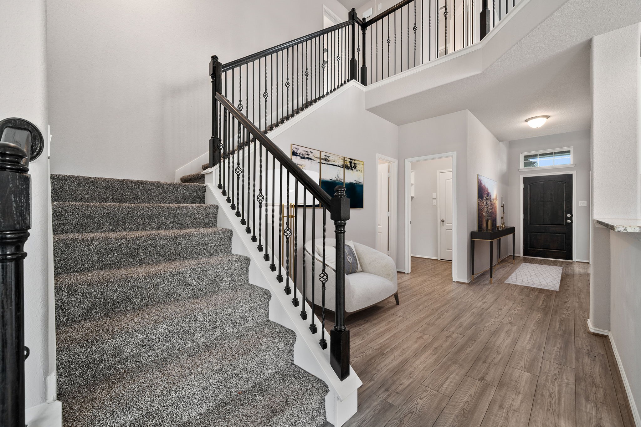 2330 Ocean Pass Lane Rosenberg, TX 77469 - Photo 11 of 20 a view of entryway with wooden floor and stairs