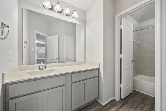 a bedroom with bed and a couch