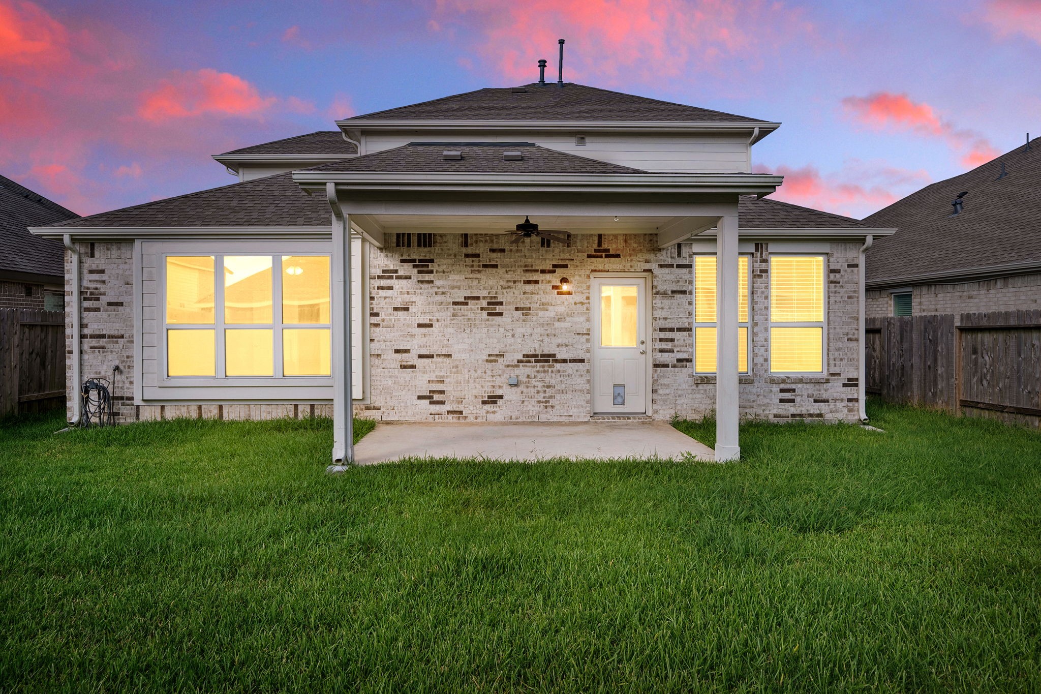 2330 Ocean Pass Lane Rosenberg, TX 77469 - Photo 18 of 20 a front view of a house with a garden