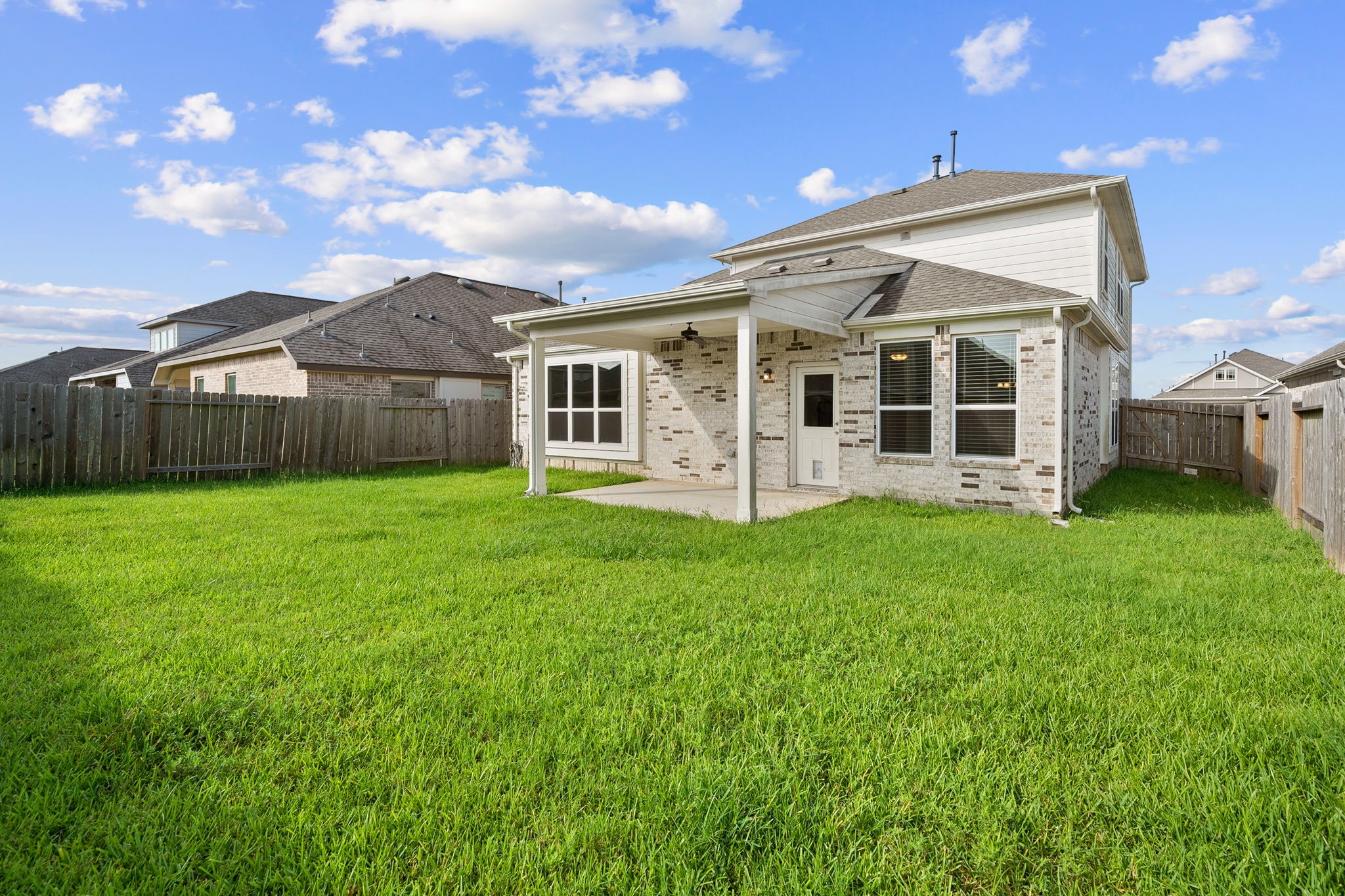 2330 Ocean Pass Lane Rosenberg, TX 77469 - Photo 19 of 20 a view of a house with a yard and sitting area