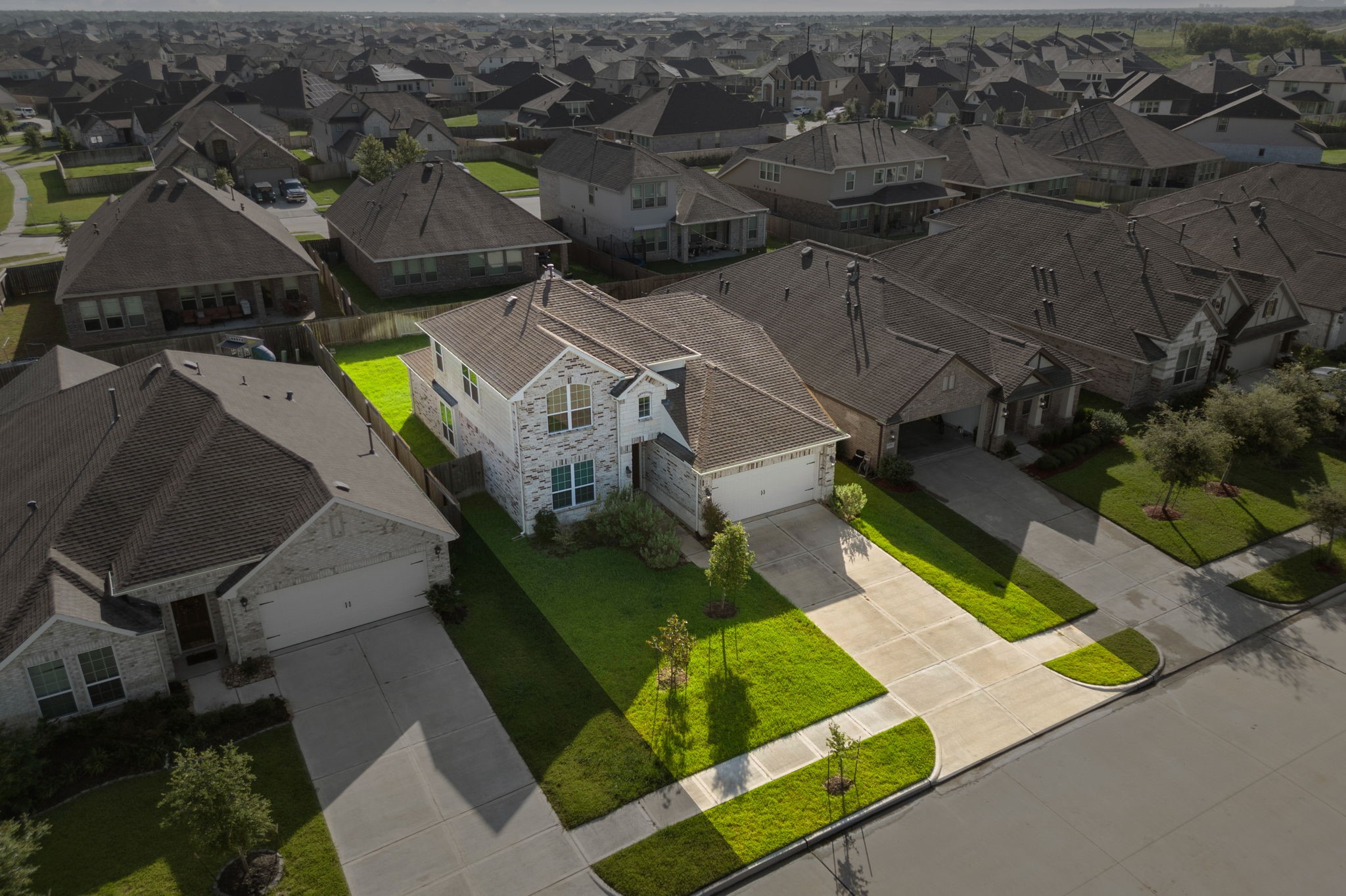 2330 Ocean Pass Lane Rosenberg, TX 77469 - Photo 2 of 20 an aerial view of a house with a garden and swimming pool