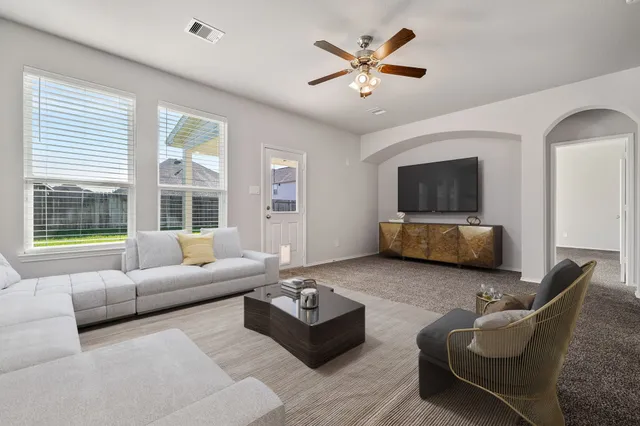 a kitchen with kitchen island granite countertop a sink and stainless steel appliances