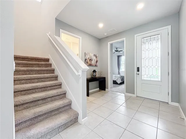 a view of entryway with furniture and a window