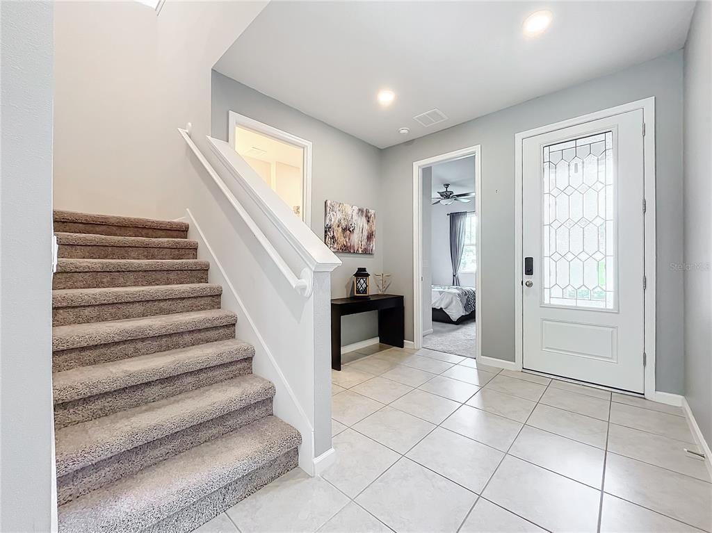 8060 Cherrystone Street Leesburg, FL 34748 - Photo 2 of 30 a view of entryway with furniture and a window
