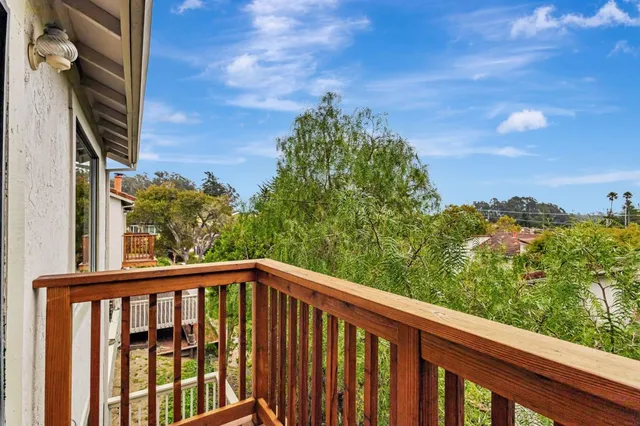 a view of a balcony with an outdoor space