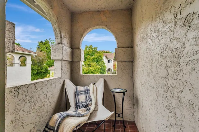a blue chair sitting next to a window