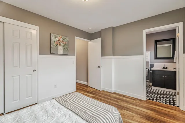 a bedroom with a bed and cabinets