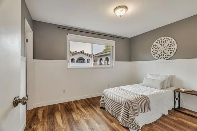 a bedroom with a bed and a window