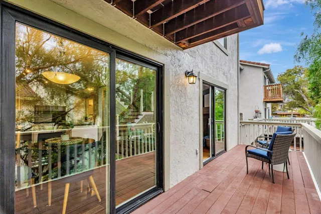 a view of a porch with wooden floor