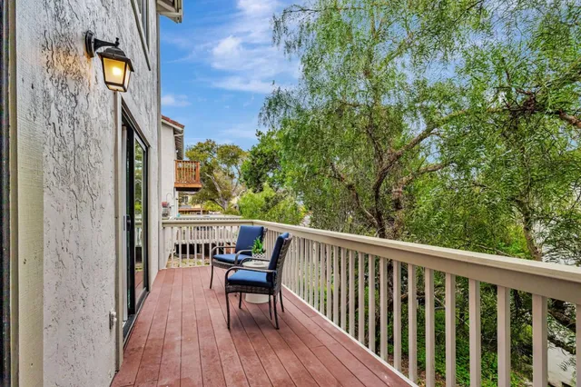 a view of balcony with furniture