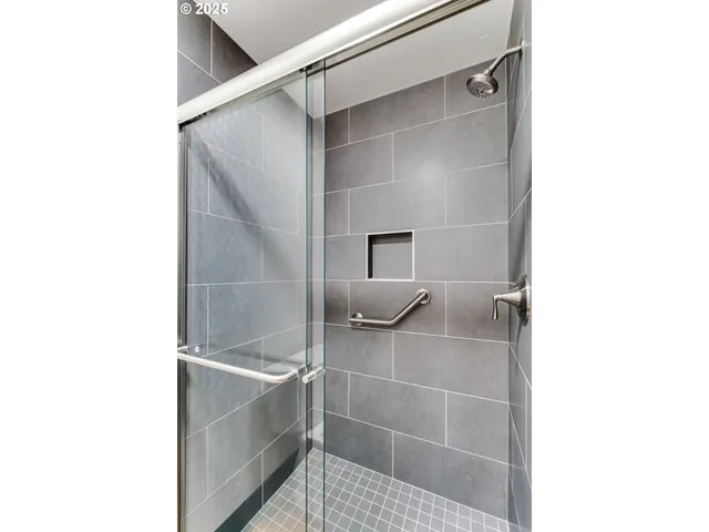 a bathroom with a bathtub and shower