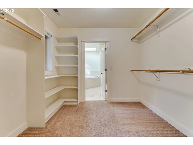 a view of an empty walk in closet