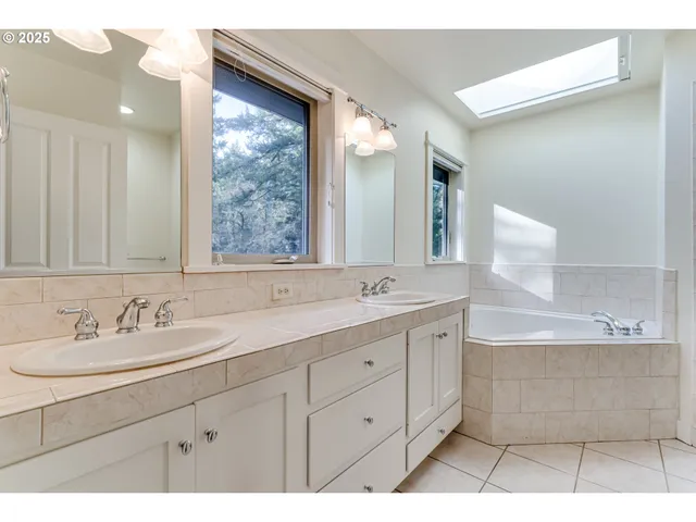 a bathroom with a double vanity sink mirror and double