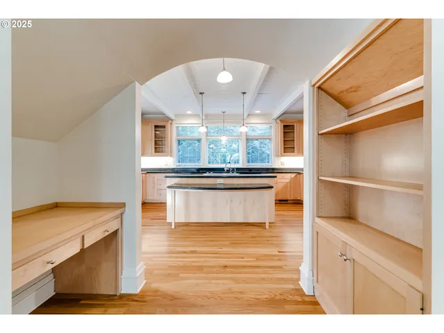a view of kitchen with wooden floor