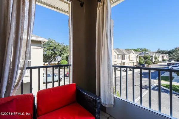 a balcony with furniture and city view