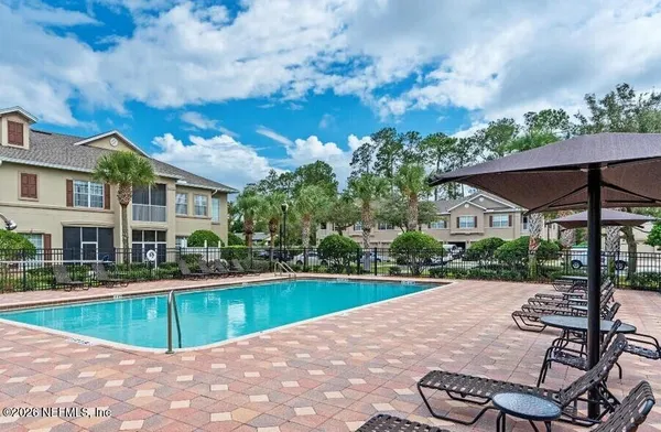 a view of a swimming pool with a patio