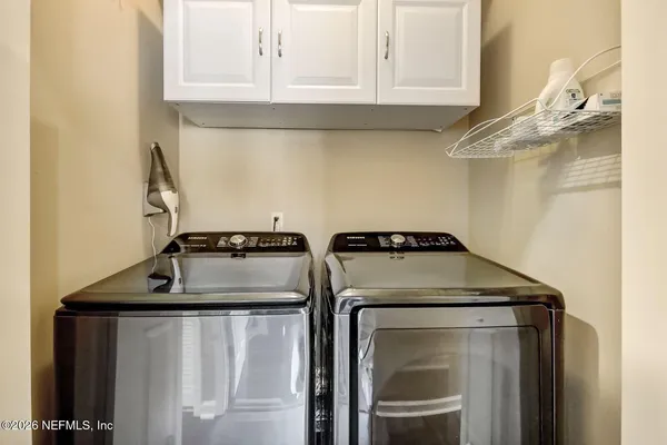 a utility room with dryer and washer