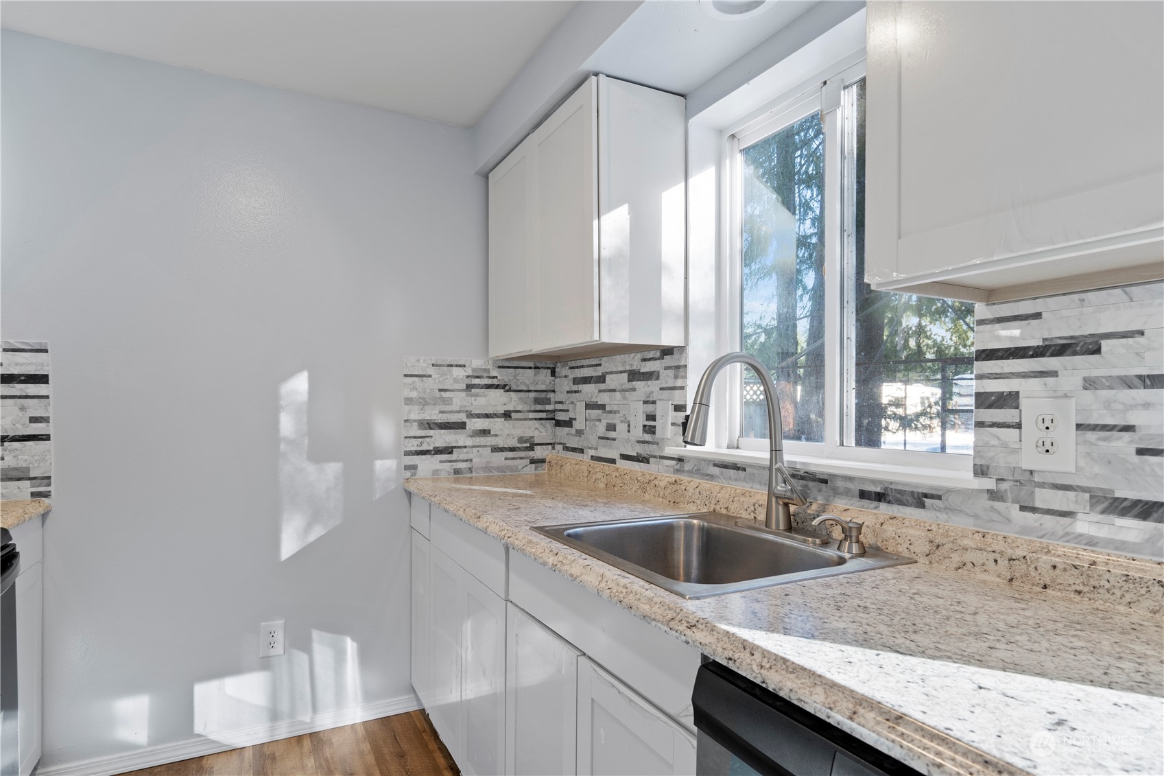 8323 Cedar Grove Avenue Concrete, WA 98237 - Photo 11 of 37 a kitchen with granite countertop a sink and a stove
