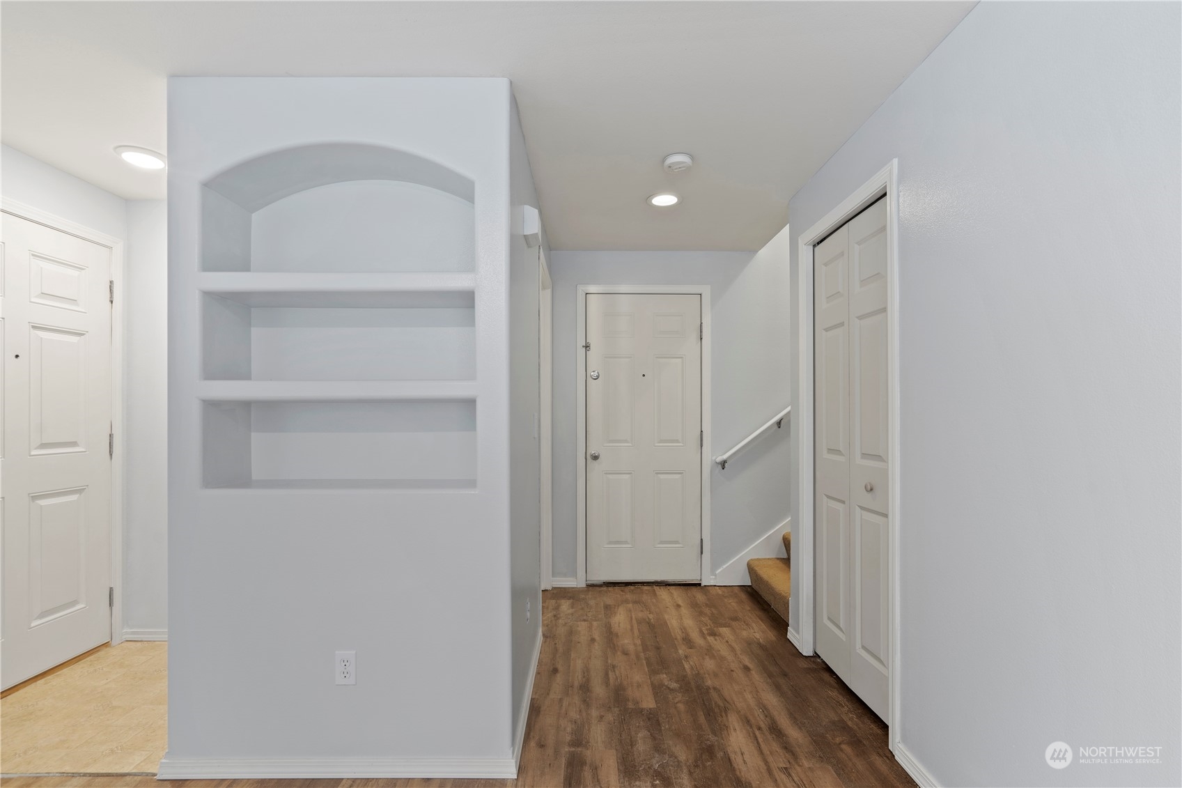 8323 Cedar Grove Avenue Concrete, WA 98237 - Photo 13 of 37 a view of a hallway with wooden floor and a bathroom