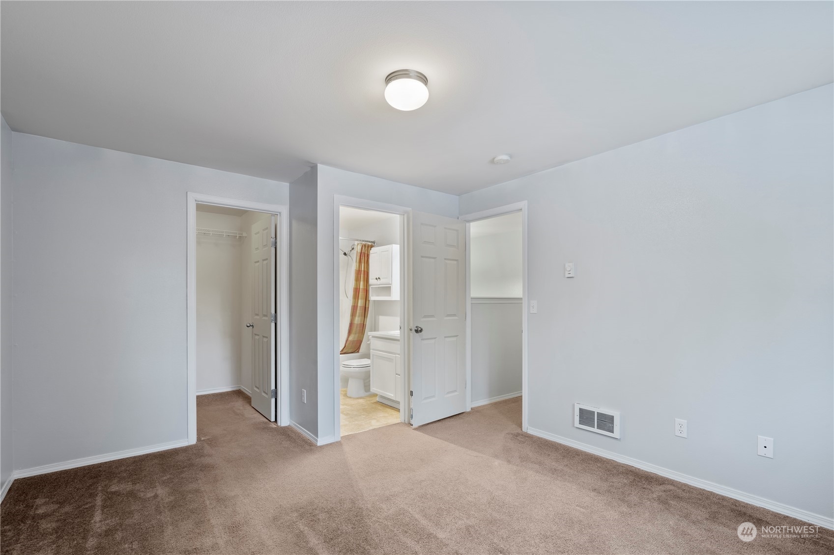 8323 Cedar Grove Avenue Concrete, WA 98237 - Photo 19 of 37 an empty room with closet and mirror