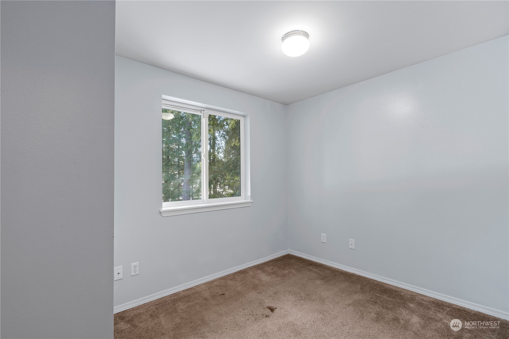 8323 Cedar Grove Avenue Concrete, WA 98237 - Photo 27 of 37 an empty room with a window