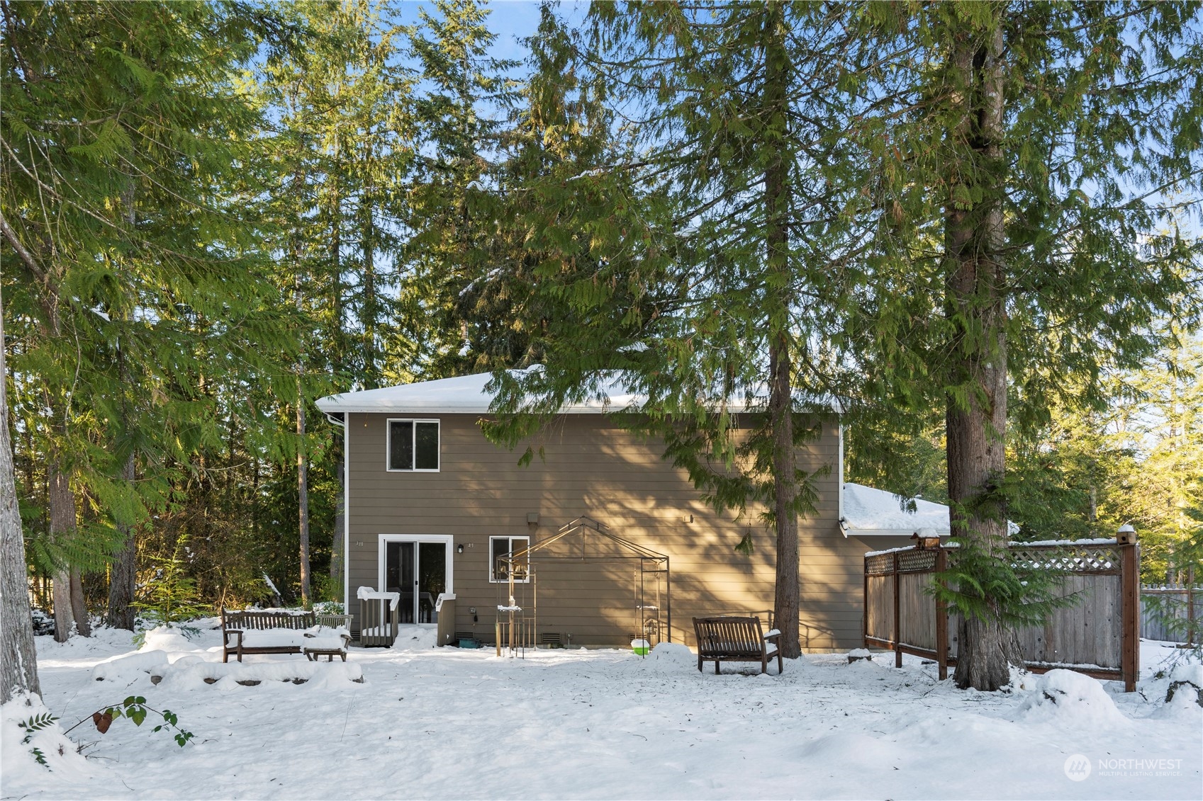 8323 Cedar Grove Avenue Concrete, WA 98237 - Photo 35 of 37 a view of a house with a tree next to a road