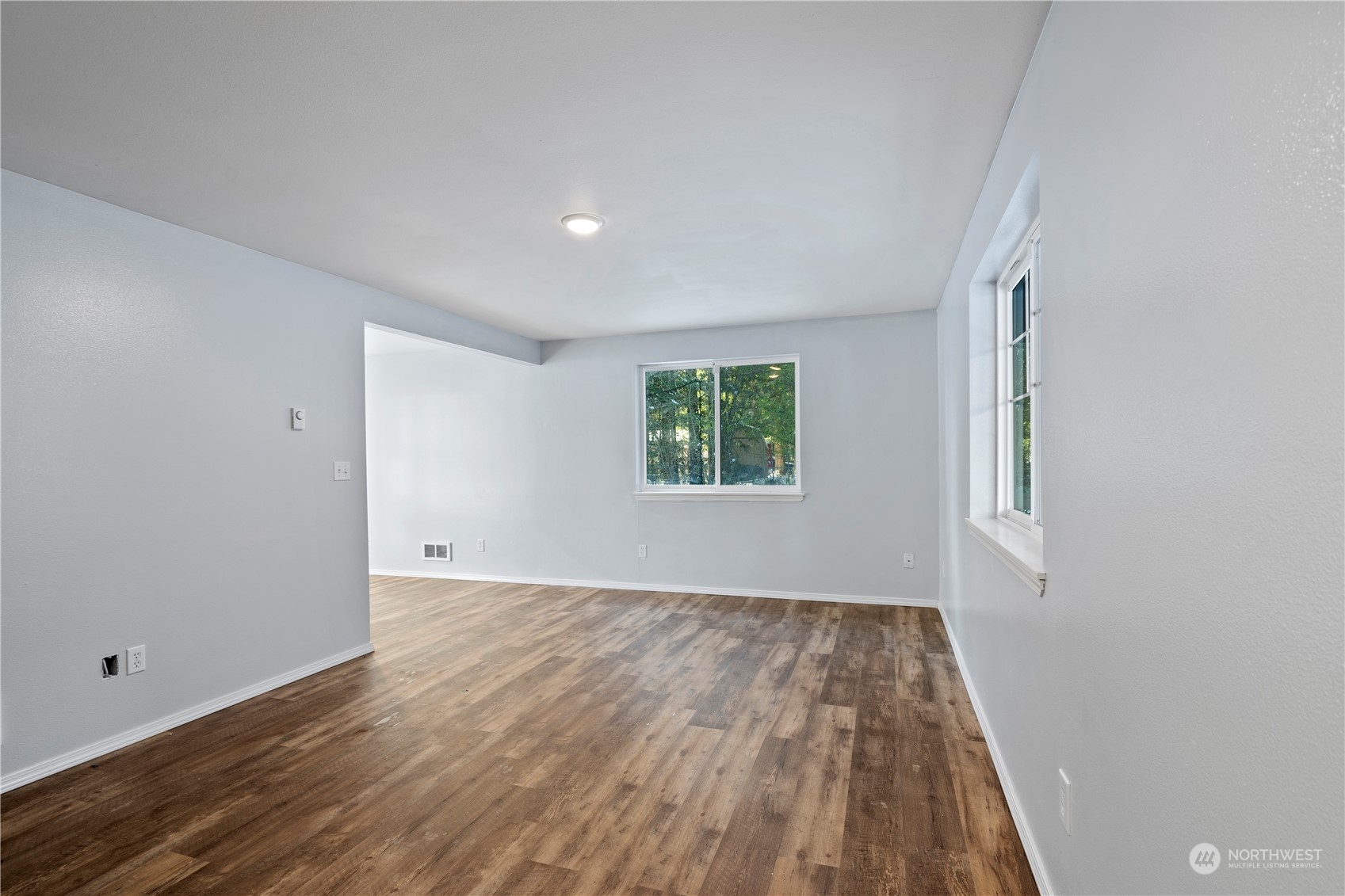 8323 Cedar Grove Avenue Concrete, WA 98237 - Photo 8 of 37 an empty room with wooden floor and windows
