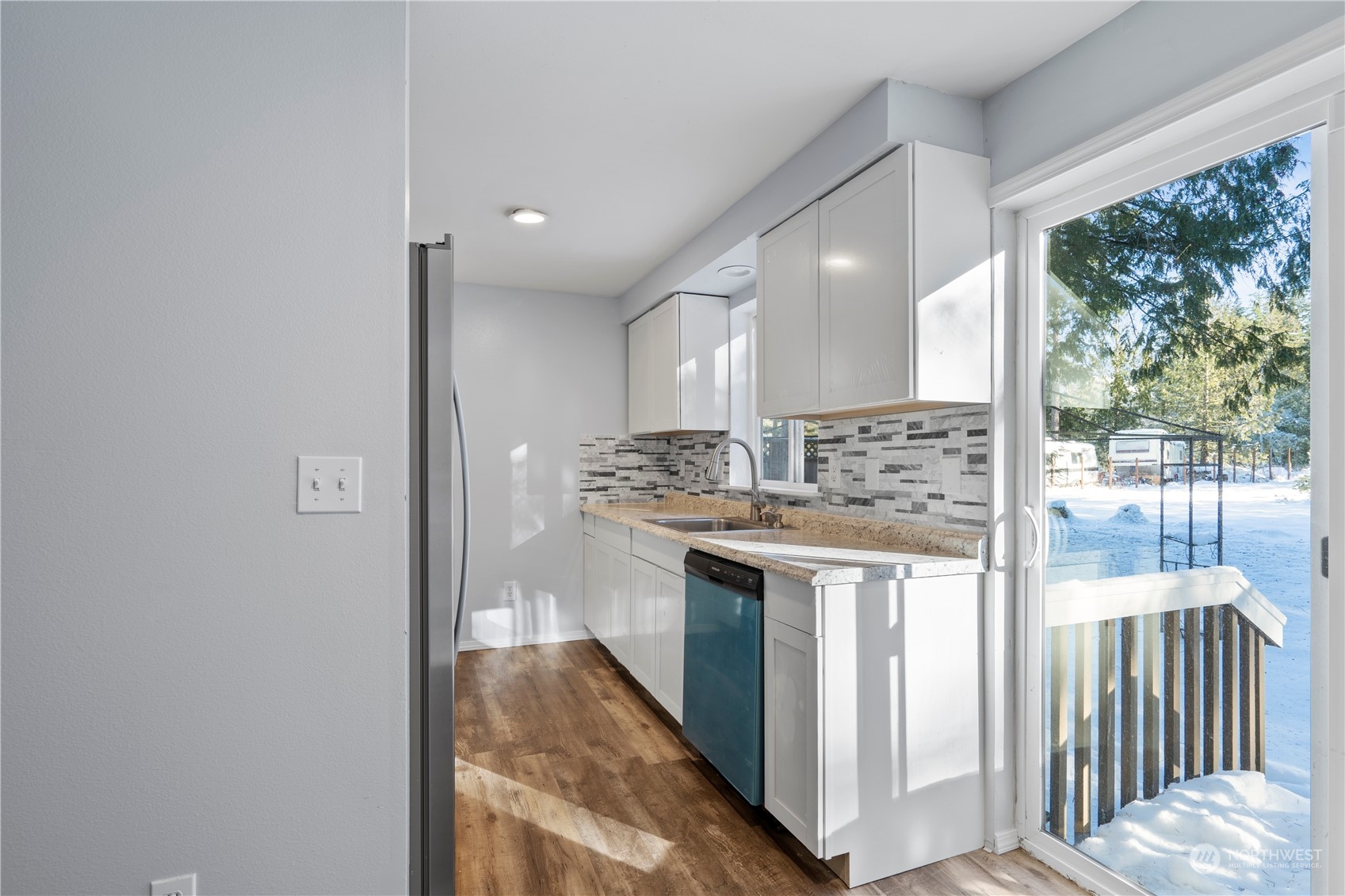 8323 Cedar Grove Avenue Concrete, WA 98237 - Photo 9 of 37 a kitchen with kitchen island sink stove and refrigerator