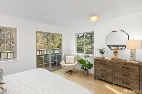 a large bed sitting in a bedroom and table