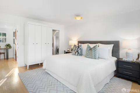 a balcony with wooden floor and fence