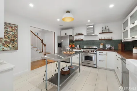 a view of a a dining room with furniture window and wooden floor
