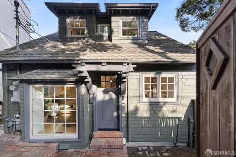 a front view of a house with glass windows