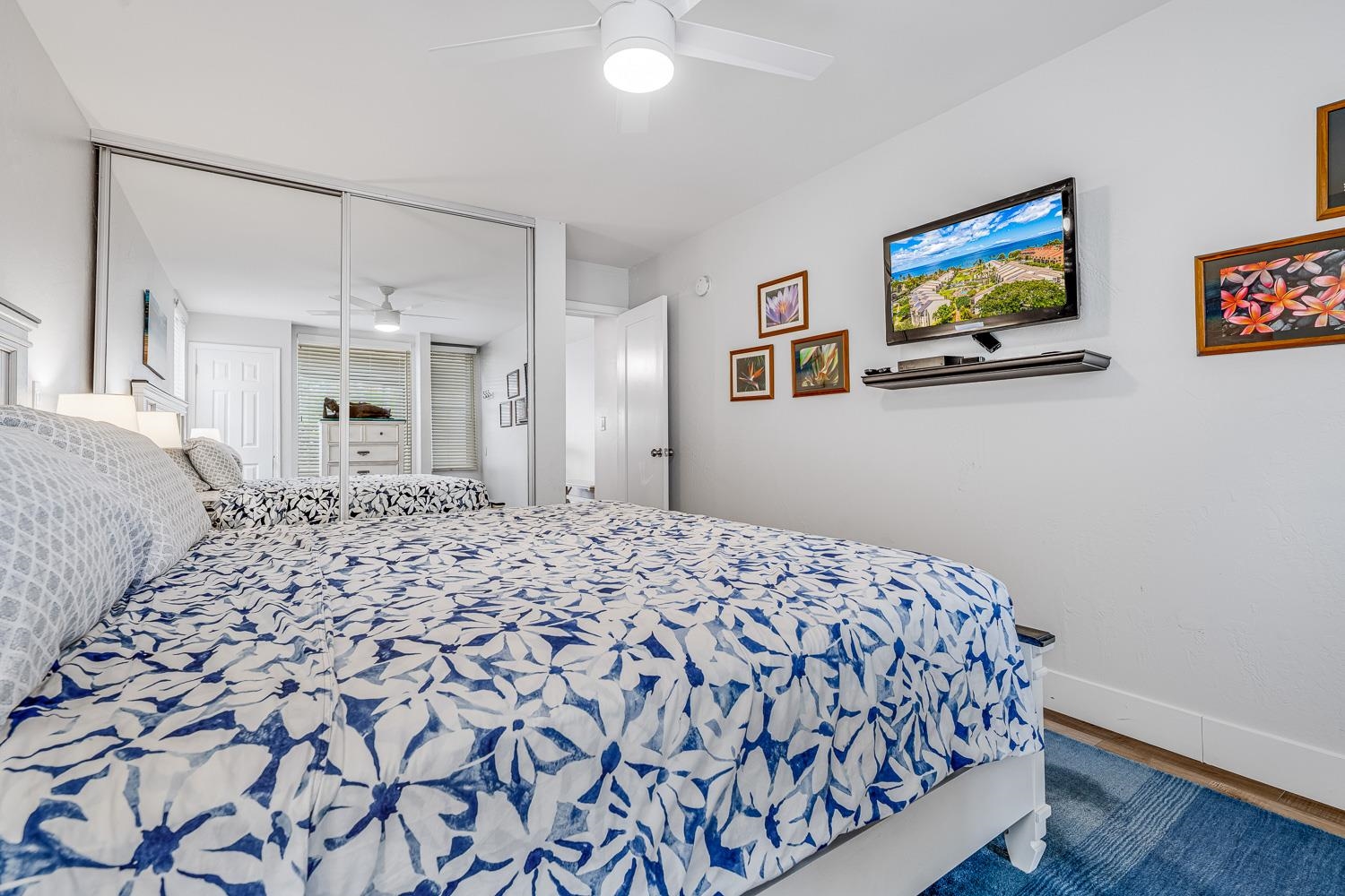 2737 South Kihei Road, Unit 142 Kihei, HI 96753 - Photo 16 of 43 a bedroom with a bed and painting on the wall