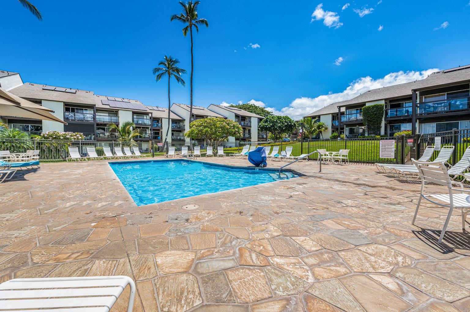 2737 South Kihei Road, Unit 142 Kihei, HI 96753 - Photo 33 of 43 a view of a patio with a table and chairs
