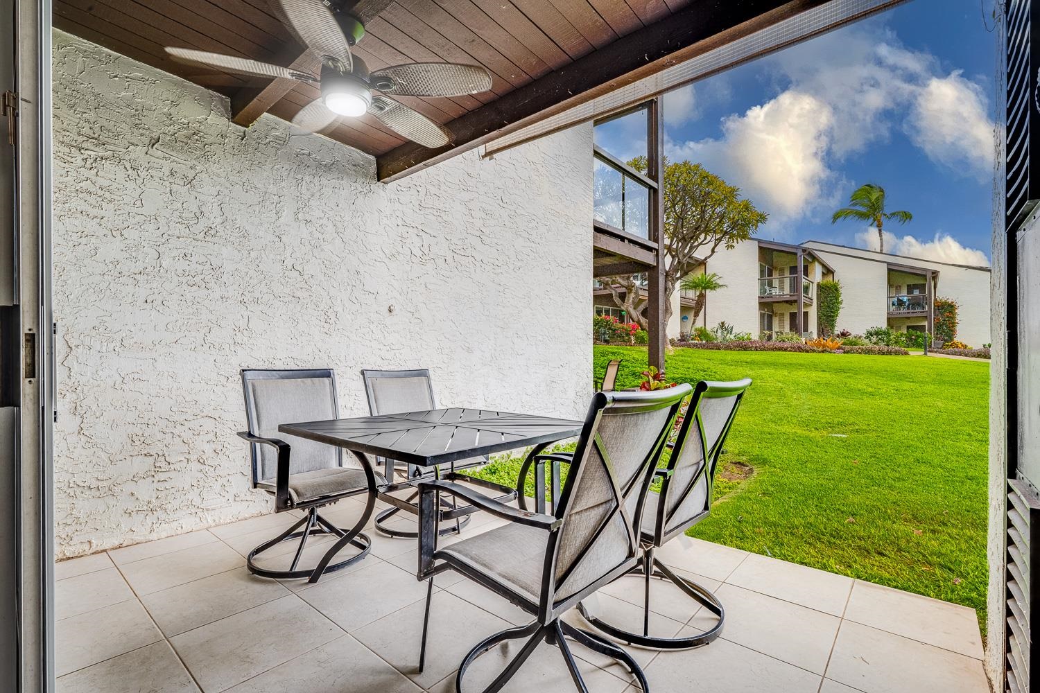 2737 South Kihei Road, Unit 142 Kihei, HI 96753 - Photo 5 of 43 a view of a patio with table and chairs and potted plants