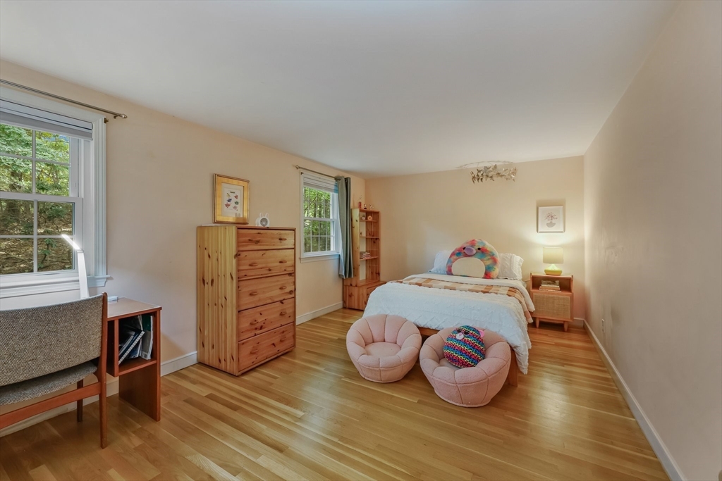 9 Tower Drive Dover, MA 02030 - Photo 16 of 26 a bedroom with a bed and wooden floor