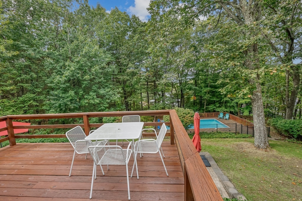 9 Tower Drive Dover, MA 02030 - Photo 21 of 26 a view of deck with chairs and wooden floor