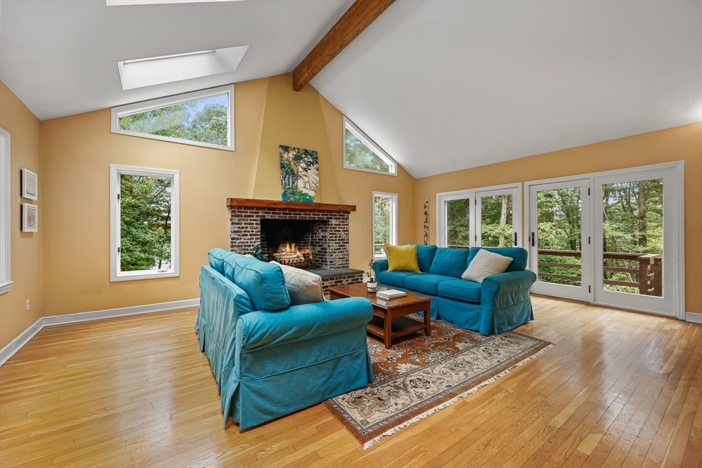 9 Tower Drive Dover, MA 02030 - Photo 4 of 26 a living room with furniture and a fireplace