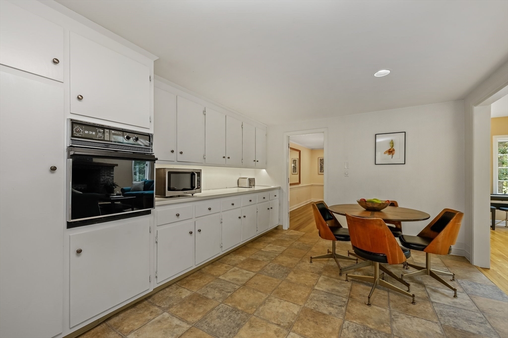 9 Tower Drive Dover, MA 02030 - Photo 6 of 26 a kitchen with stainless steel appliances kitchen island granite countertop a sink and cabinets