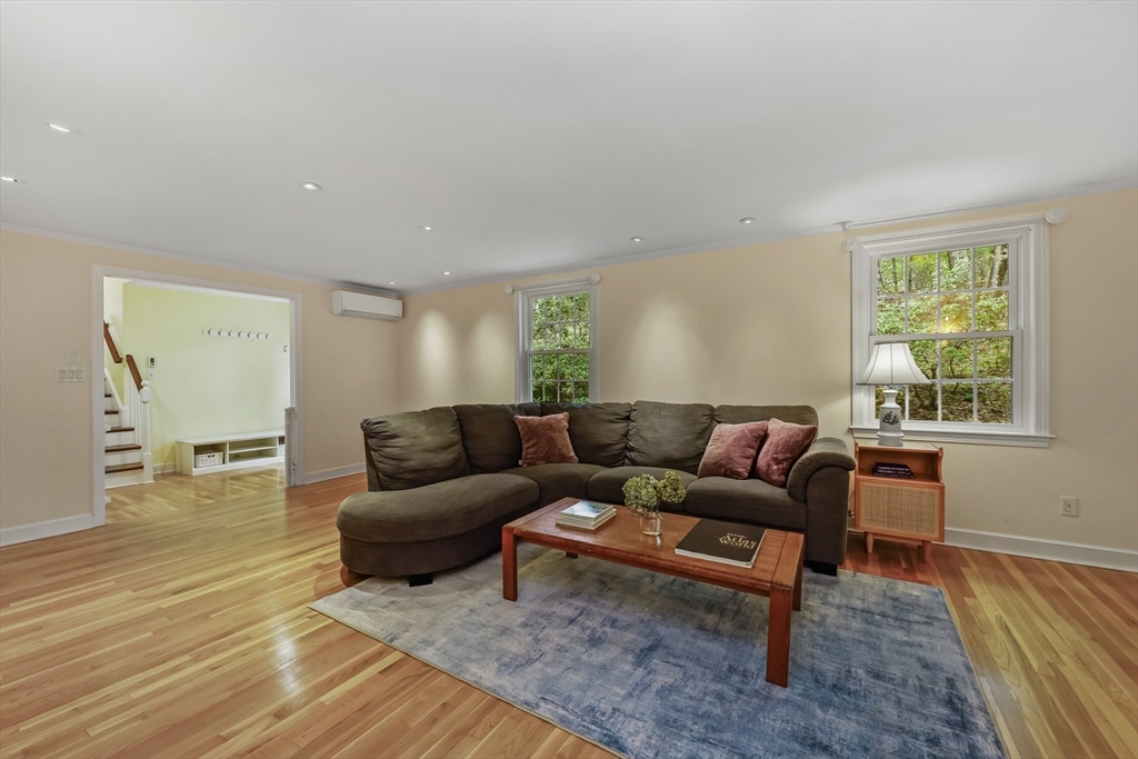 9 Tower Drive Dover, MA 02030 - Photo 10 of 26 a living room with furniture and a wooden floor