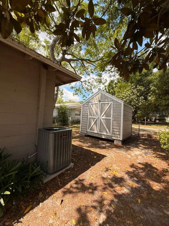 1065 North 10th Street Eagle Lake, FL 33839 - Photo 15 of 16 a view of a backyard with a tree