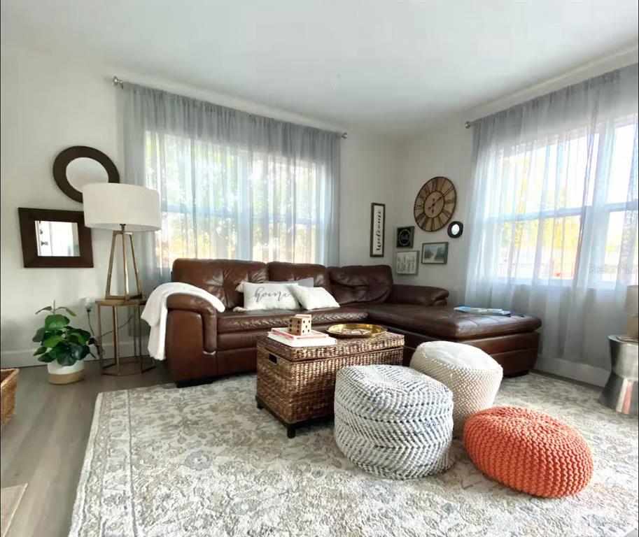 1065 North 10th Street Eagle Lake, FL 33839 - Photo 2 of 16 a living room with furniture and a large window