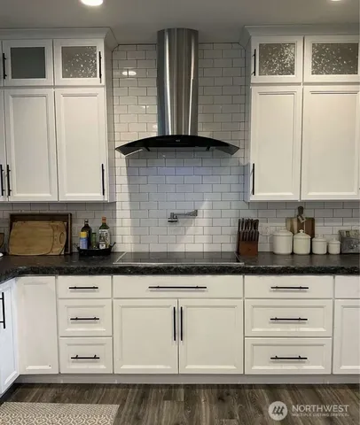 a bathroom with a sink and a shower