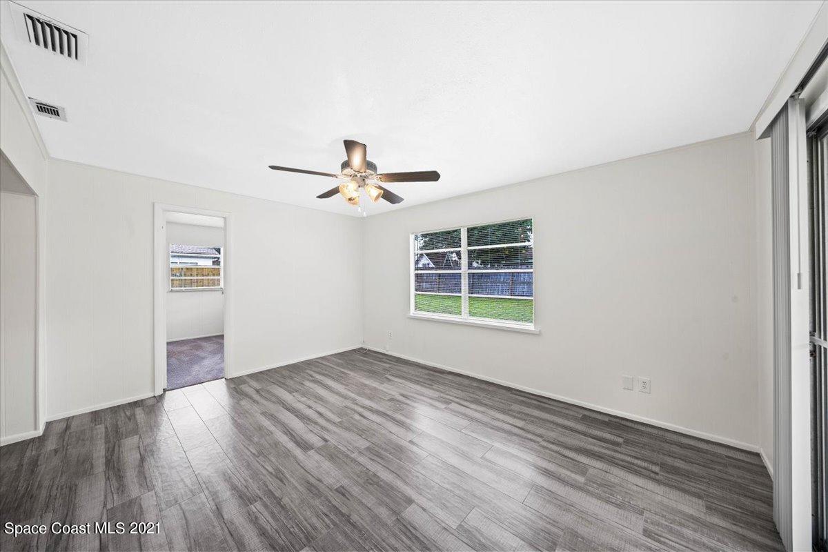 561 Parker Road Melbourne, FL 32904 - Photo 19 of 36 Slider access to screened porch