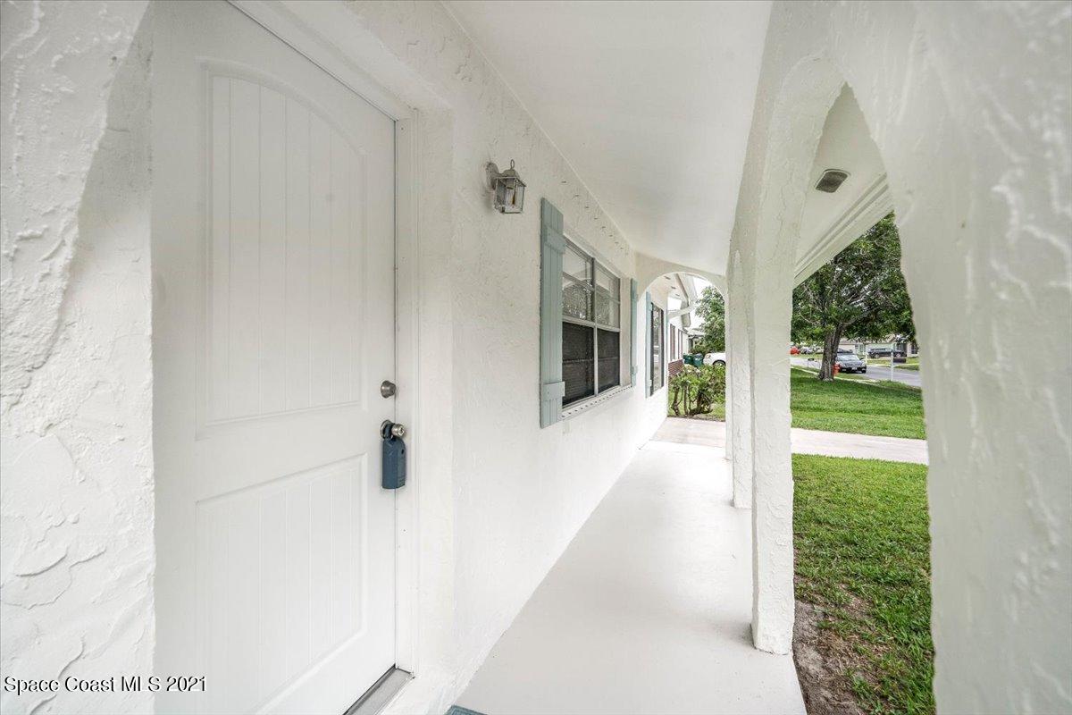 561 Parker Road Melbourne, FL 32904 - Photo 4 of 36 Welcome - Covered entry