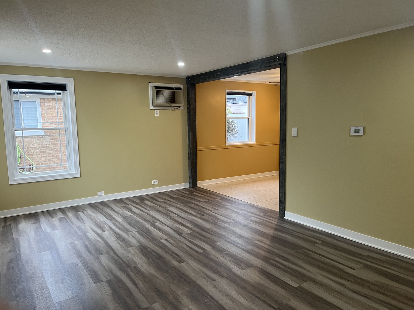 2337 175th Street Homewood, IL 60430 - Photo 4 of 12 a view of an empty room with wooden floor and a window